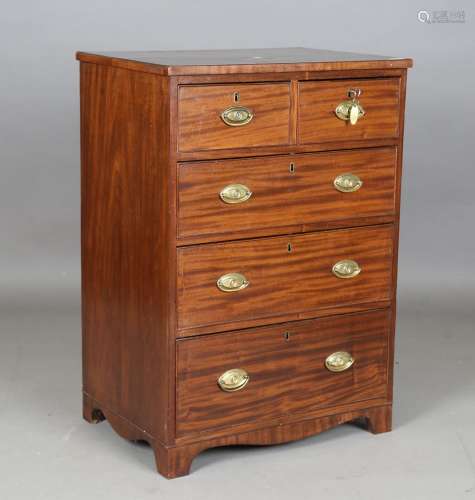 A narrow Regency mahogany chest of oak-lined drawers with br...
