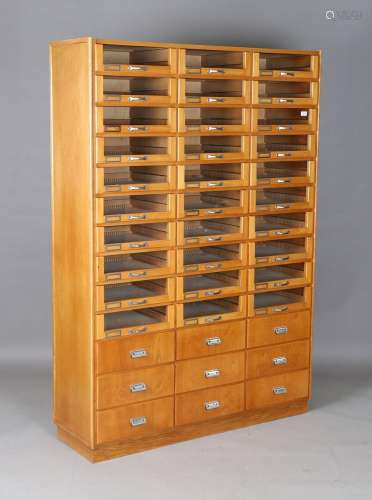 A late 20th century oak and beech haberdashery cabinet