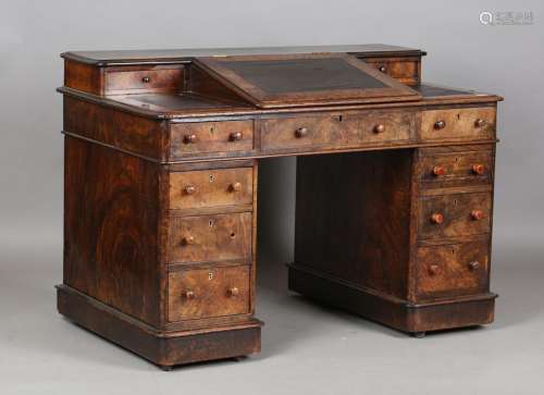 A mid-Victorian burr walnut twin pedestal desk with gallery ...