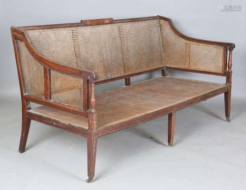 A George III mahogany framed bergère settee