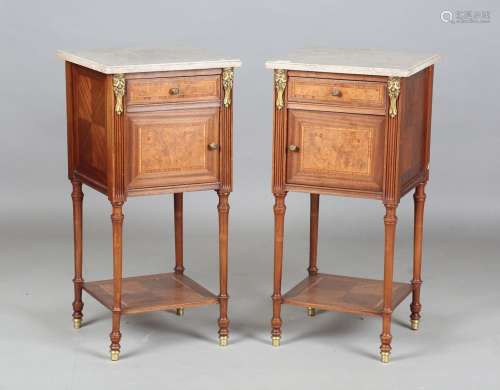 A pair of early 20th century French marble-topped bedside ca...