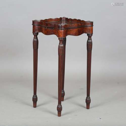 A George III mahogany kettle stand of serpentine outline