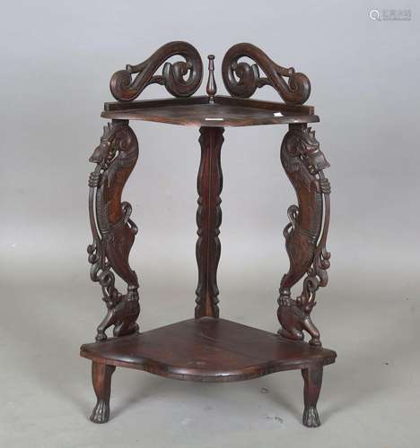 A 20th century Burmese hardwood two-tier corner shelf