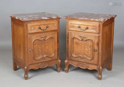 A pair of 20th century French oak marble-topped bedside cabi...