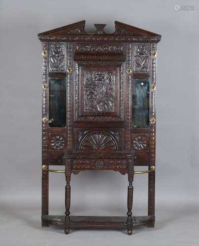 A late Victorian Jacobean Revival stained oak hall stand