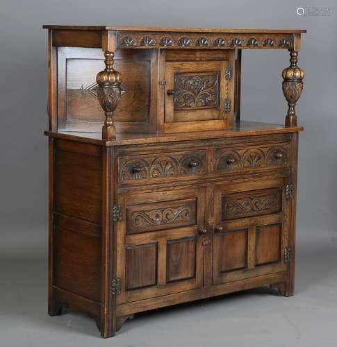 A 20th century Jacobean Revival oak court cupboard