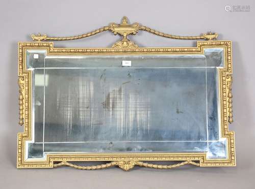 A late 20th century Neoclassical style gilt framed wall mirr...