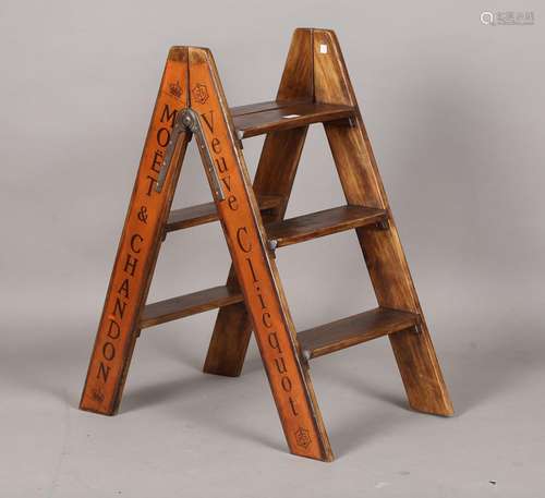 A set of modern walnut folding steps