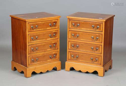 A pair of late 20th century reproduction yew chests of four ...