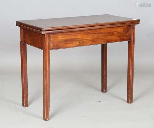 A George III mahogany fold-over tea table