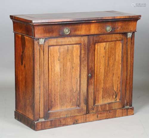 A Regency rosewood side cabinet with gilt metal mounted pila...