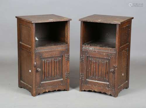 A pair of mid-20th century Jacobean Revival oak bedside cabi...