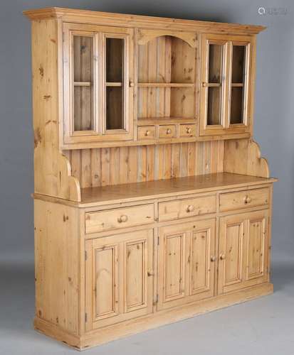 A modern reproduction pine kitchen dresser