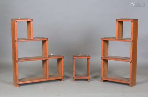 A set of mid-20th century teak hanging sectional wall shelve...