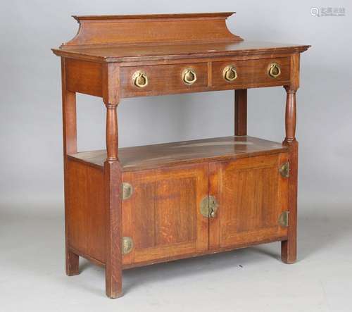 An Edwardian Arts and Crafts style oak serving table