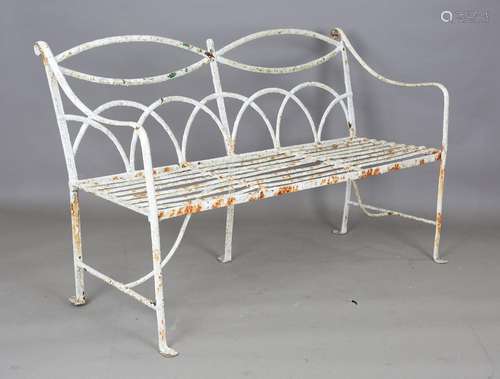 A 19th century white painted wrought iron garden bench with ...