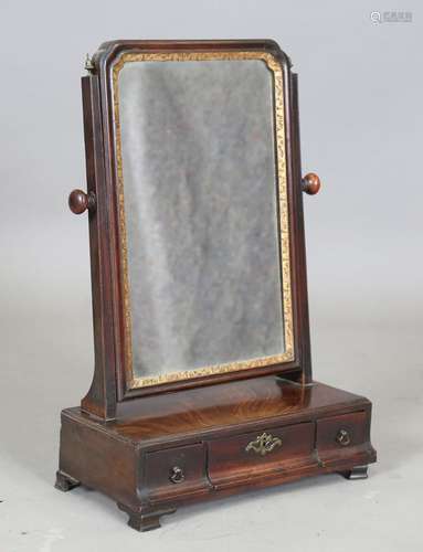 A George I mahogany swing frame mirror