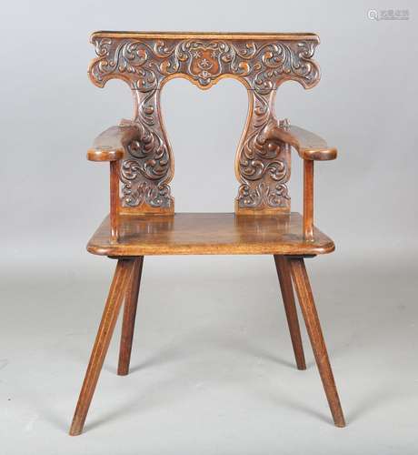 An early 19th century Continental walnut sgabello armchair