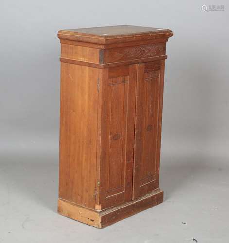 An early 20th century teak retailer's cigar cabinet