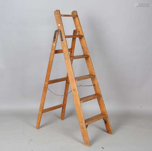 An early 20th century pine stepladder