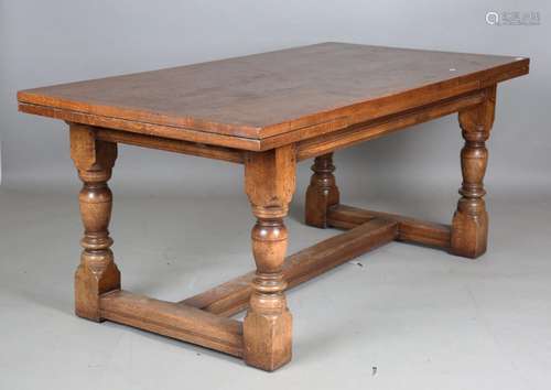 A 20th century Jacobean style solid oak draw-leaf refectory ...