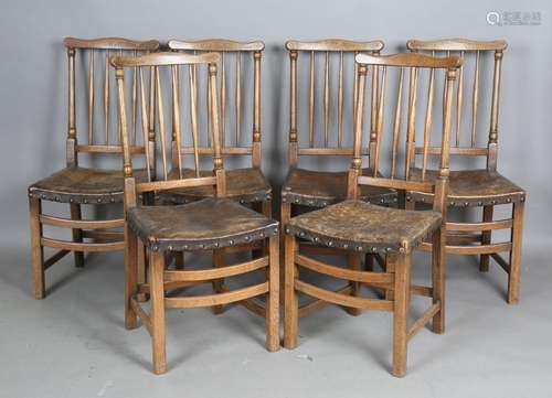 A set of six 20th century oak spindle back dining chairs wit...