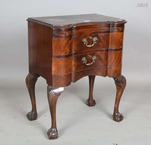 A 20th century reproduction mahogany serpentine fronted ches...