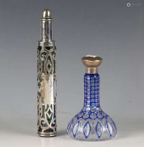 An Edwardian green glass and silver overlaid scent bottle an...