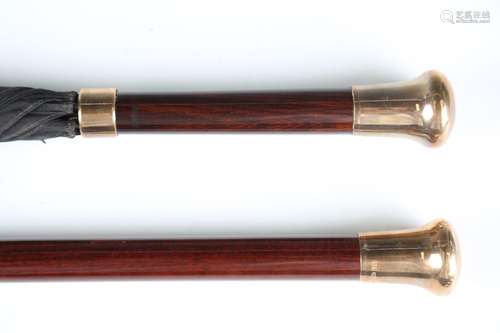 A mid-20th century hardwood walking cane and matching umbrel...