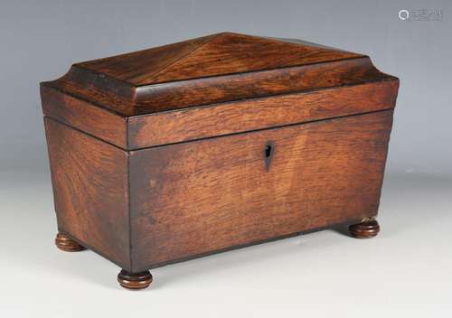 A Regency rosewood tea caddy of sarcophagus form with compar...