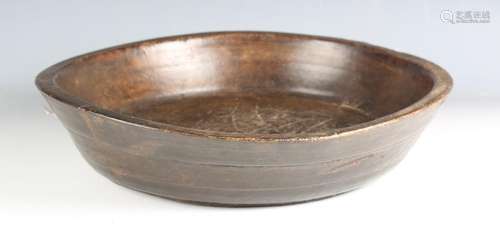 An 18th century provincial patinated treen dairy bowl