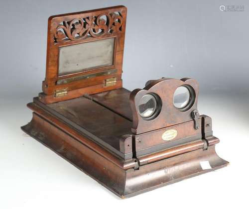 A late 19th century walnut table-top stereoscopic viewer by ...