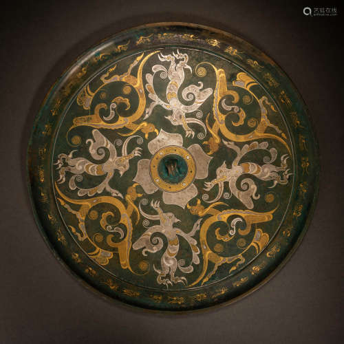 Han Dynasty bronze mirror with gold and silver dragon and ph...