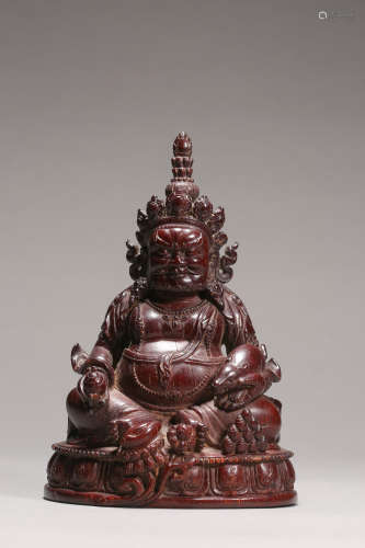 Carved Figure of Seated Jambhala