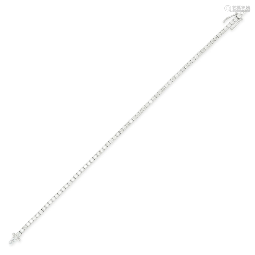 A DIAMOND LINE BRACELET set with a single row of round brill...