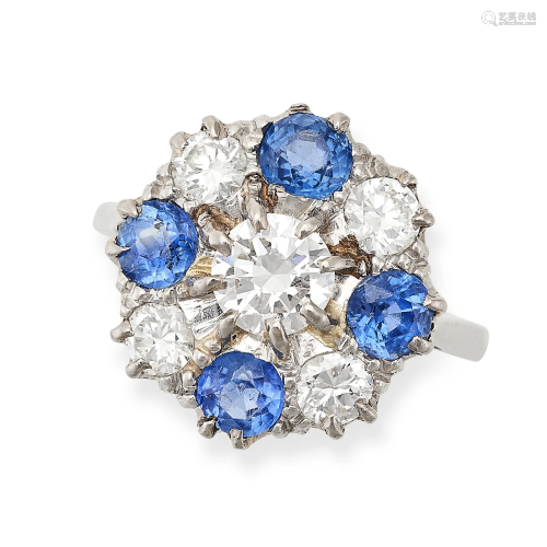 A SAPPHIRE AND DIAMOND RING set with a round brilliant cut d...