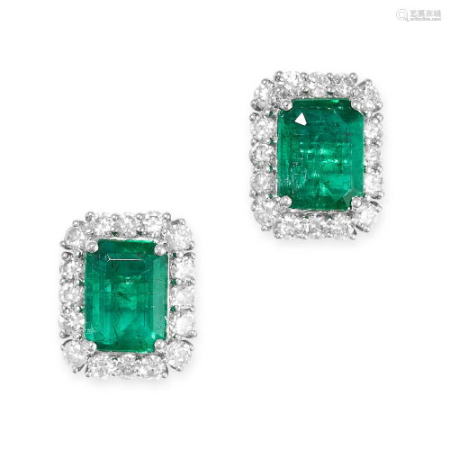 A PAIR OF EMERALD AND DIAMOND CLUSTER EARRINGS each set with...