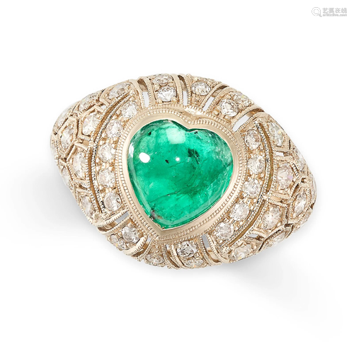 AN EMERALD AND DIAMOND RING in bombe design, set with a cent...