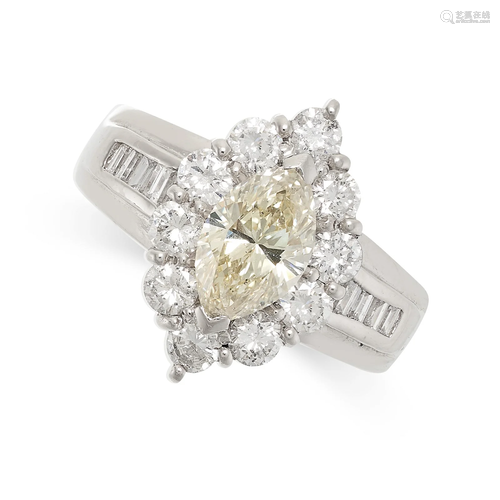 A YELLOW DIAMOND CLUSTER RING in platinum, set with a marqui...