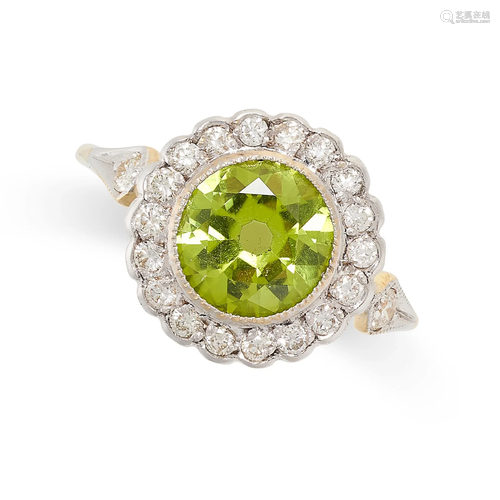 A PERIDOT AND DIAMOND RING set with a round cut peridot of 0...