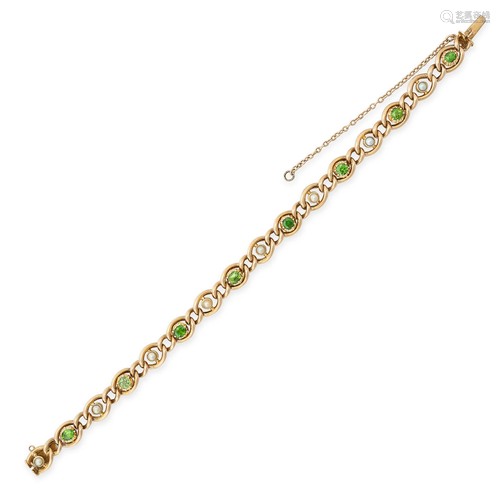 AN ANTIQUE GREEN GARNET AND PEARL BRACELET in 15ct yellow go...