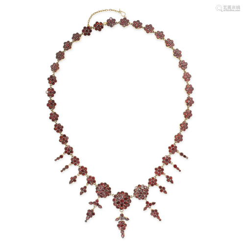 AN ANTIQUE GARNET RIVIERE NECKLACE, 19TH CENTURY in yellow g...