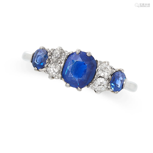 A SAPPHIRE AND DIAMOND RING set with three graduated sapphir...