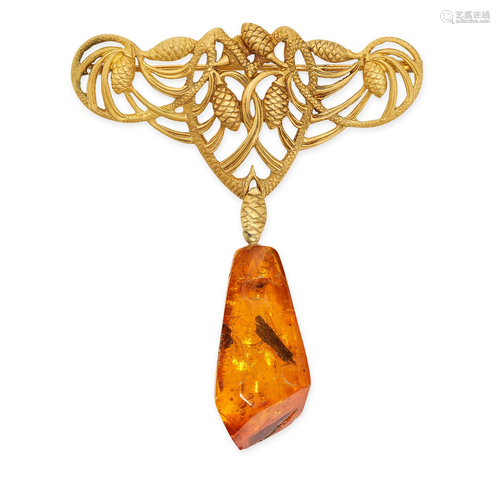 AN ART NOUVEAU AMBER BROOCH in yellow gold, the scrolling bo...