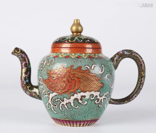 A PURPLE CLAY TEAPOT WITH FISH-DRAGON DESIGN.