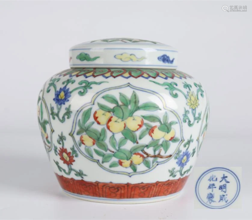 A PORCELAIN JAR WITH MELONS AND FRUITS DESIGN.