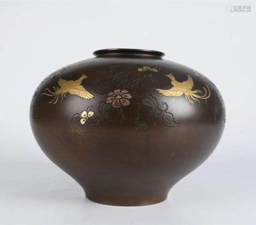 A Bronze JAR WITH FLOWERS AND BIRDS DESIGN.