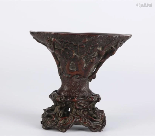 AN AGALWOOD CUP WITH PLUM BLOSSOMS DESIGN.