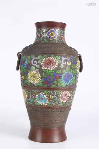 A Bronze BLUING BOTTLE WITH FLOWERS DESIGN.