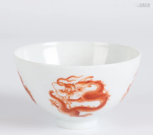 A PORCELAIN BOWL WITH IRON-RED DRAGON DESIGN.